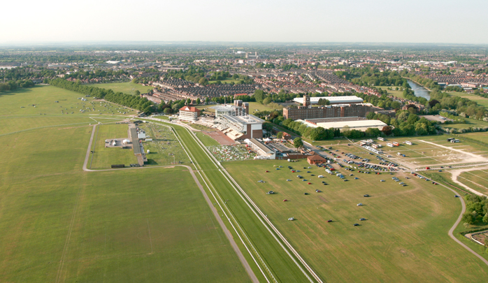 The shadow of the air balloon falls over the grandstand of the &ldquo;Knavesmire&rdquo;, York Race course as the hot air balloon ride rises up on the hot air from the balloon burners. One of the simplest forms of aviation ballooning is also one of the safest.